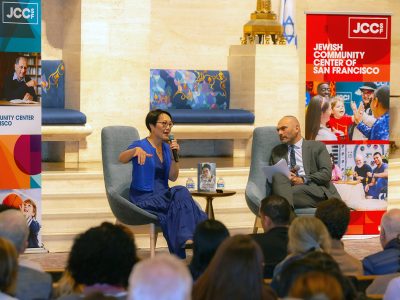 Rabbi Angela Buchdahl, left, speaks with Rabbi Ryan Bauer of Congregation Emanu-El in San Francisco, December 3, 2025. (Photo courtesy of the Jewish Community Center of San Francisco)
