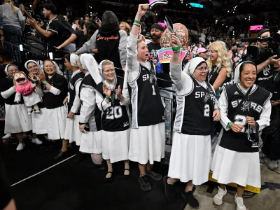 Nuns cheer before the first half of Game 6 in the Western Conference finals NBA basketball playoffs series between the San Antonio Spurs and the Oklahoma City Thunder, Thursday, May 28, 2026, in San Antonio. (AP Photo/Darren Abate)